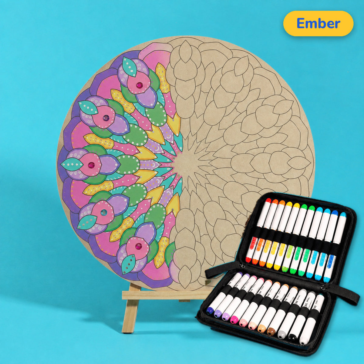 400mm Ember engraved circle art board with mandala of rounded overlapping petals, left edge coloured pink, green and blue, beside a case of 24 Nahuku markers