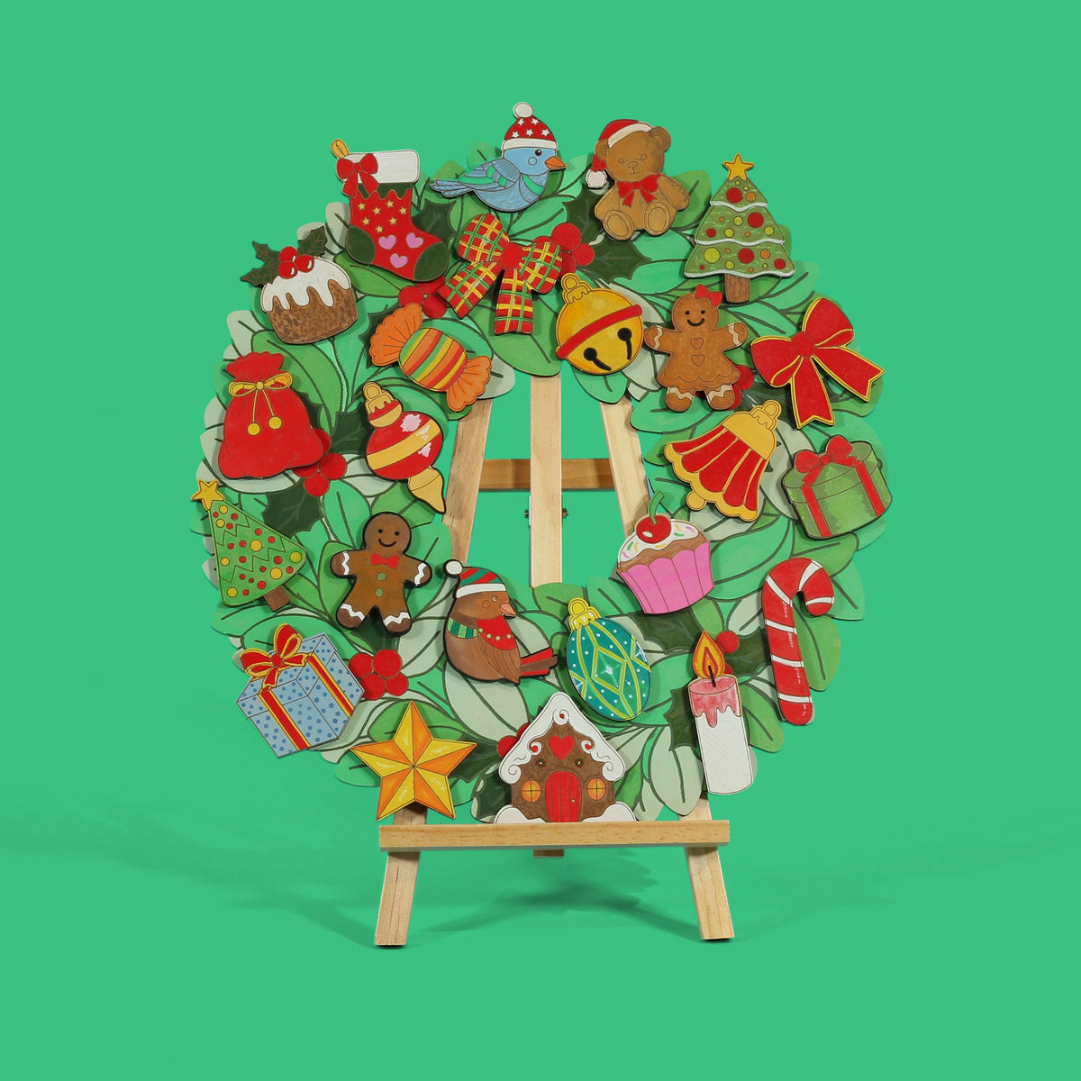Jingle Jumble Christmas wreath coloured and finished on easel with all engraved ornaments in place on Apple Green background