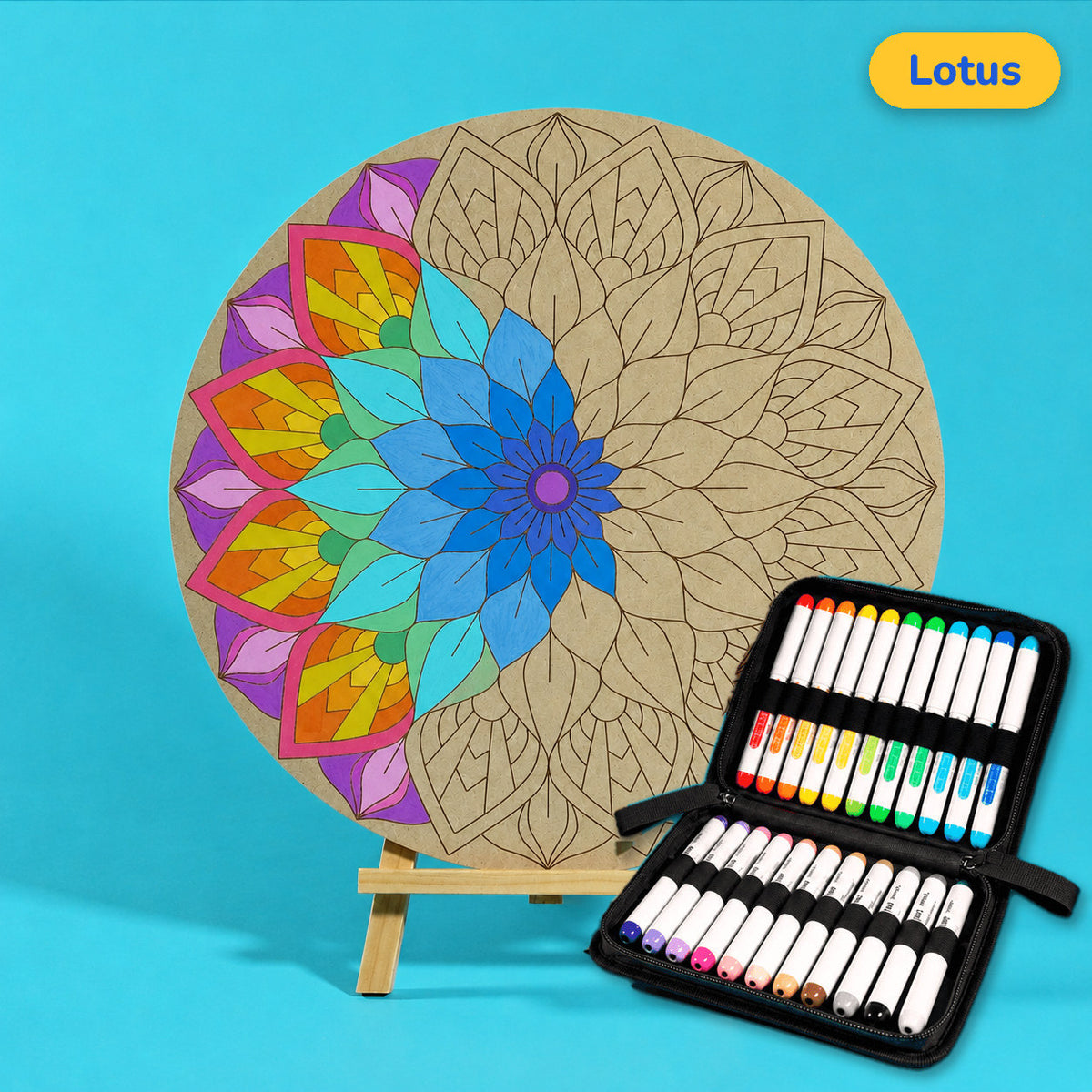 400mm Lotus engraved circle art board with mandala of layered lotus petals, left side coloured in rainbow shades, beside a case of 24 Nahuku markers