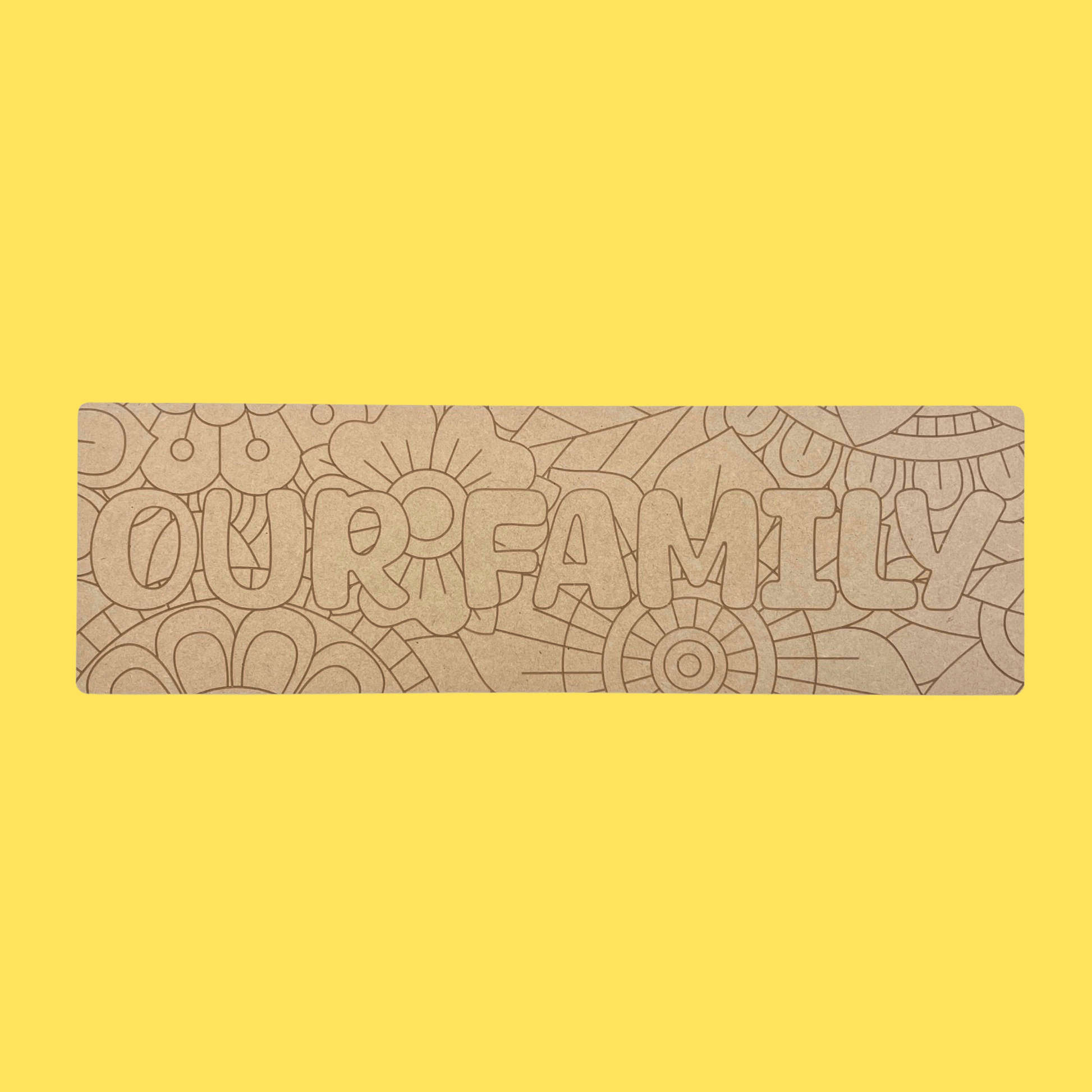 wooden board with engraved floral design and the words Our Family
