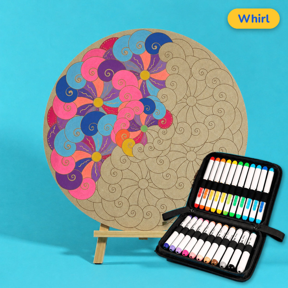 400mm Whirl engraved circle art board with mandala of spiralling swirls, top left coloured pink, navy and blue, beside a case of 24 Nahuku markers