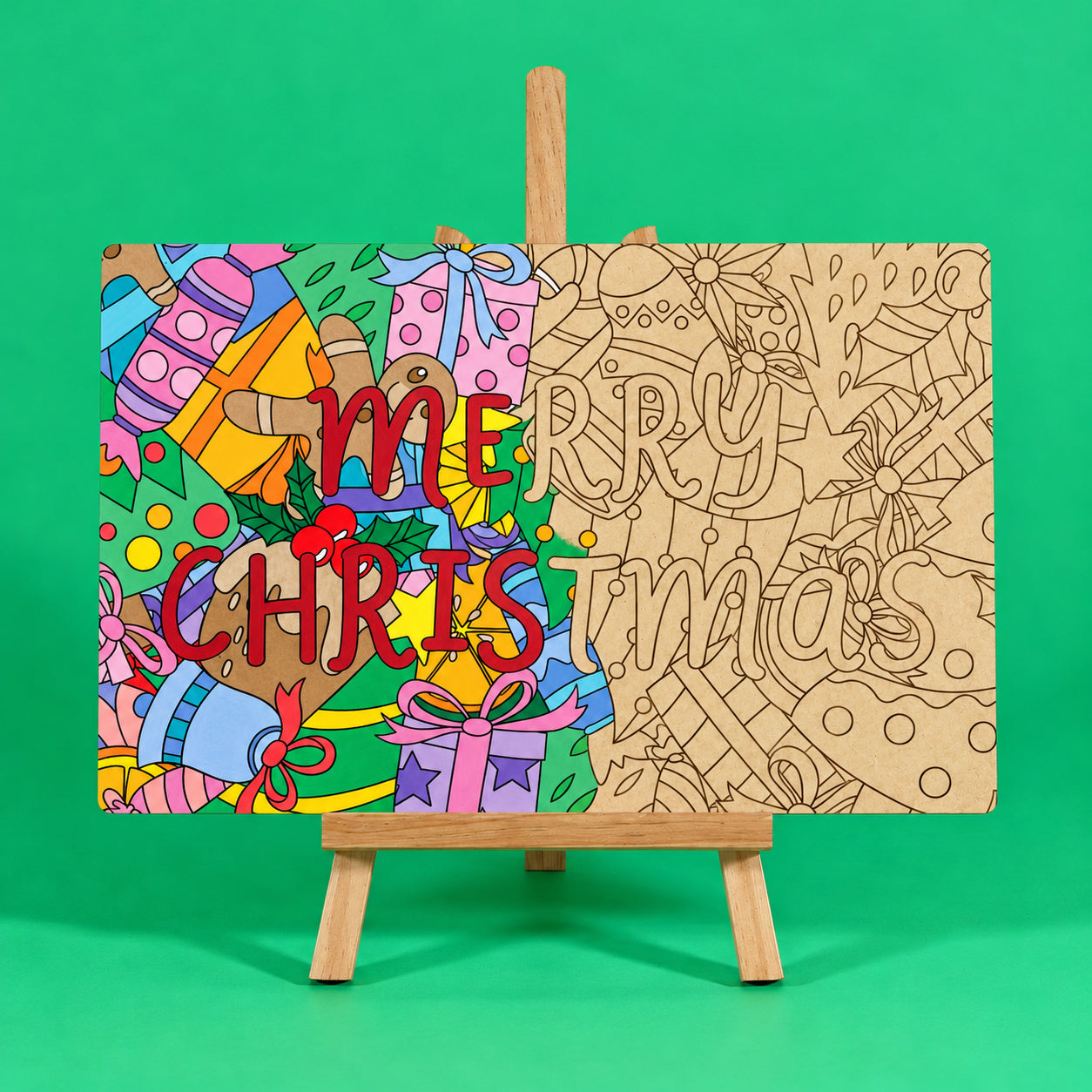 Merry Christmas engraved quote art board half coloured for inspiration and half plain uncoloured on easel on green background