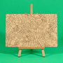 Merry Christmas engraved quote art board plain uncoloured engraved MDF board on easel ready to colour on green background