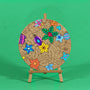 Merry Twinkle Christmas engraved art board partly coloured with yellow star, blue stars, green holly and pink and purple baubles, easel not included