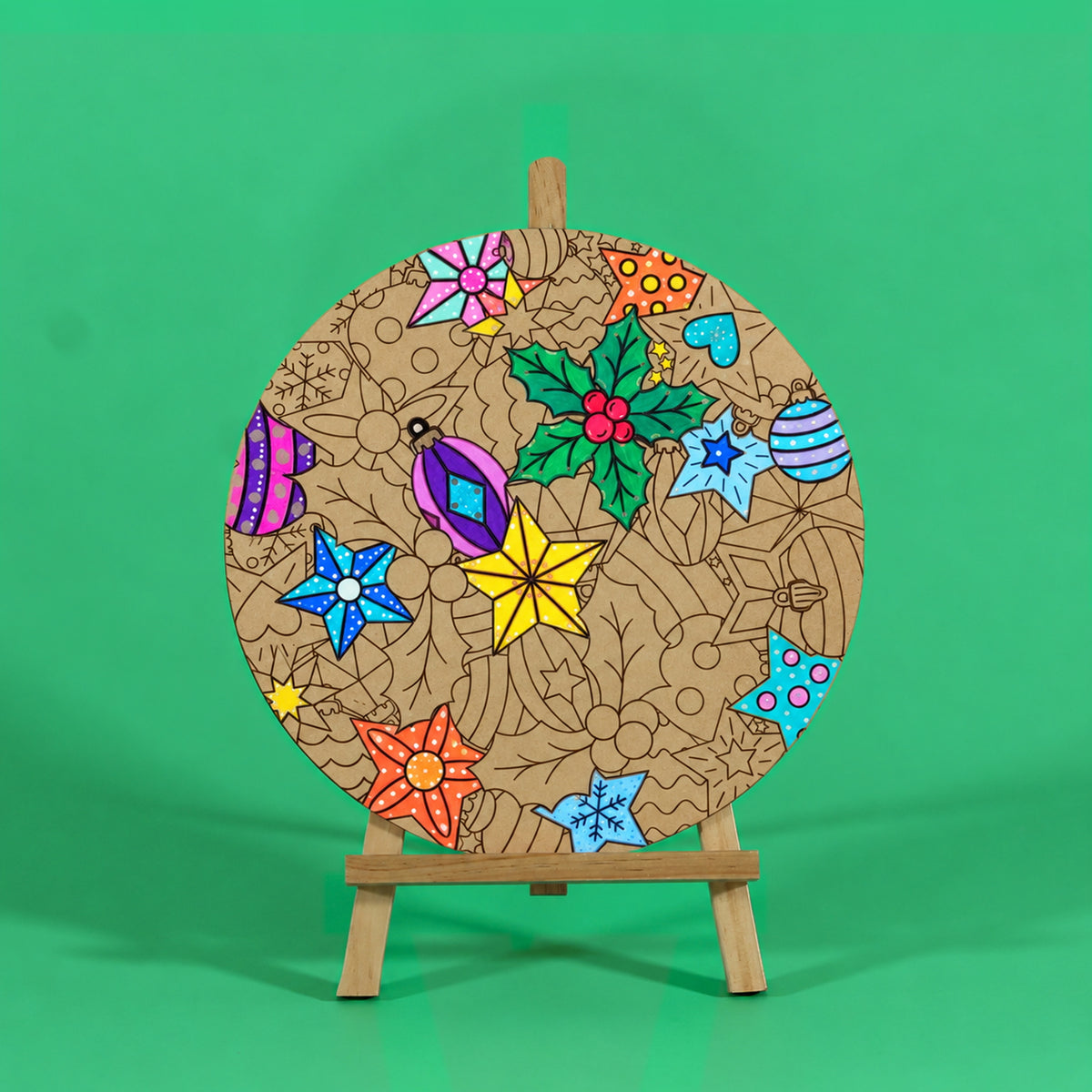 Merry Twinkle Christmas engraved art board partly coloured with yellow star, blue stars, green holly and pink and purple baubles, easel not included
