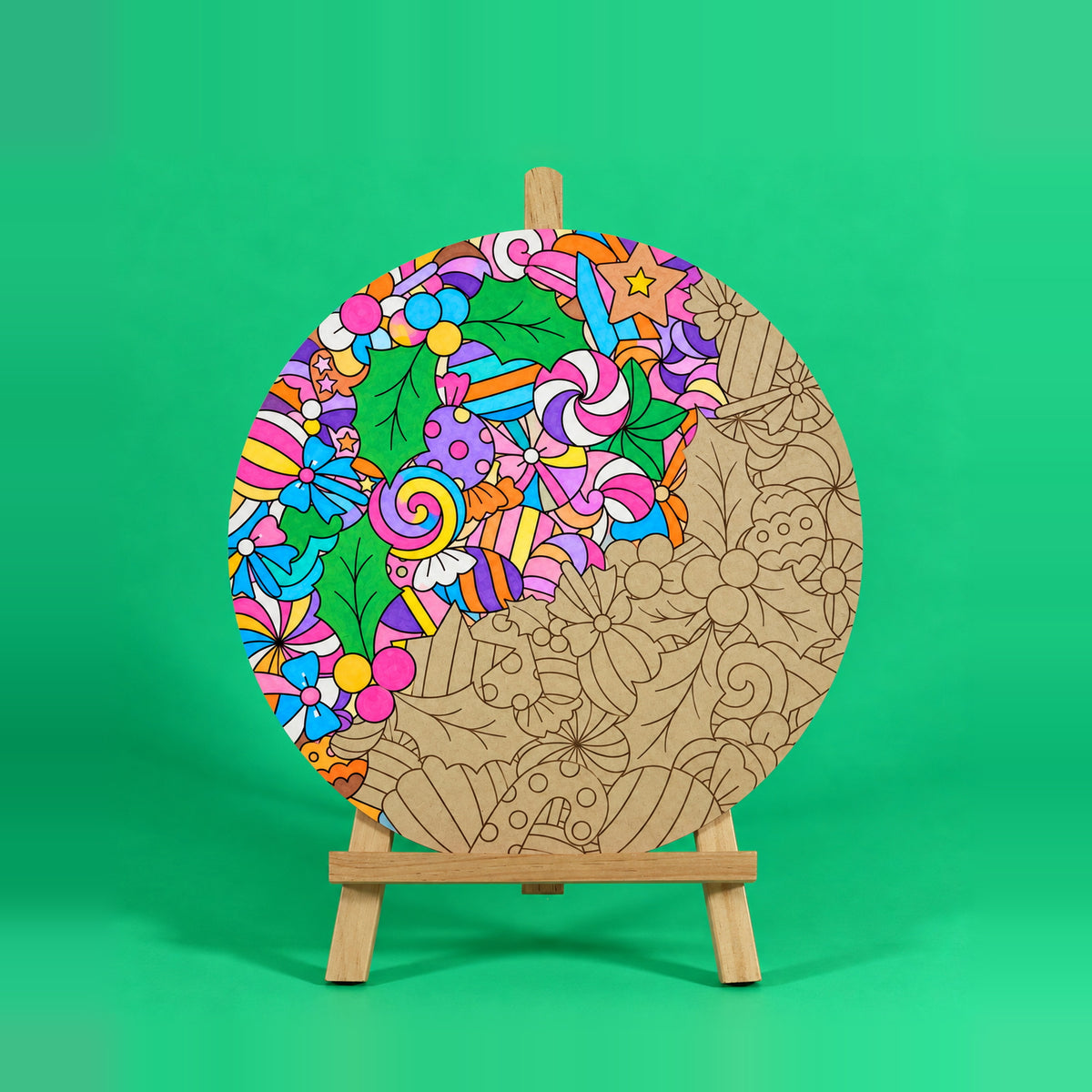Sweet Tidings Christmas engraved art board partly coloured with swirl lollipops, wrapped lollies and bows in rainbow colours, easel not included
