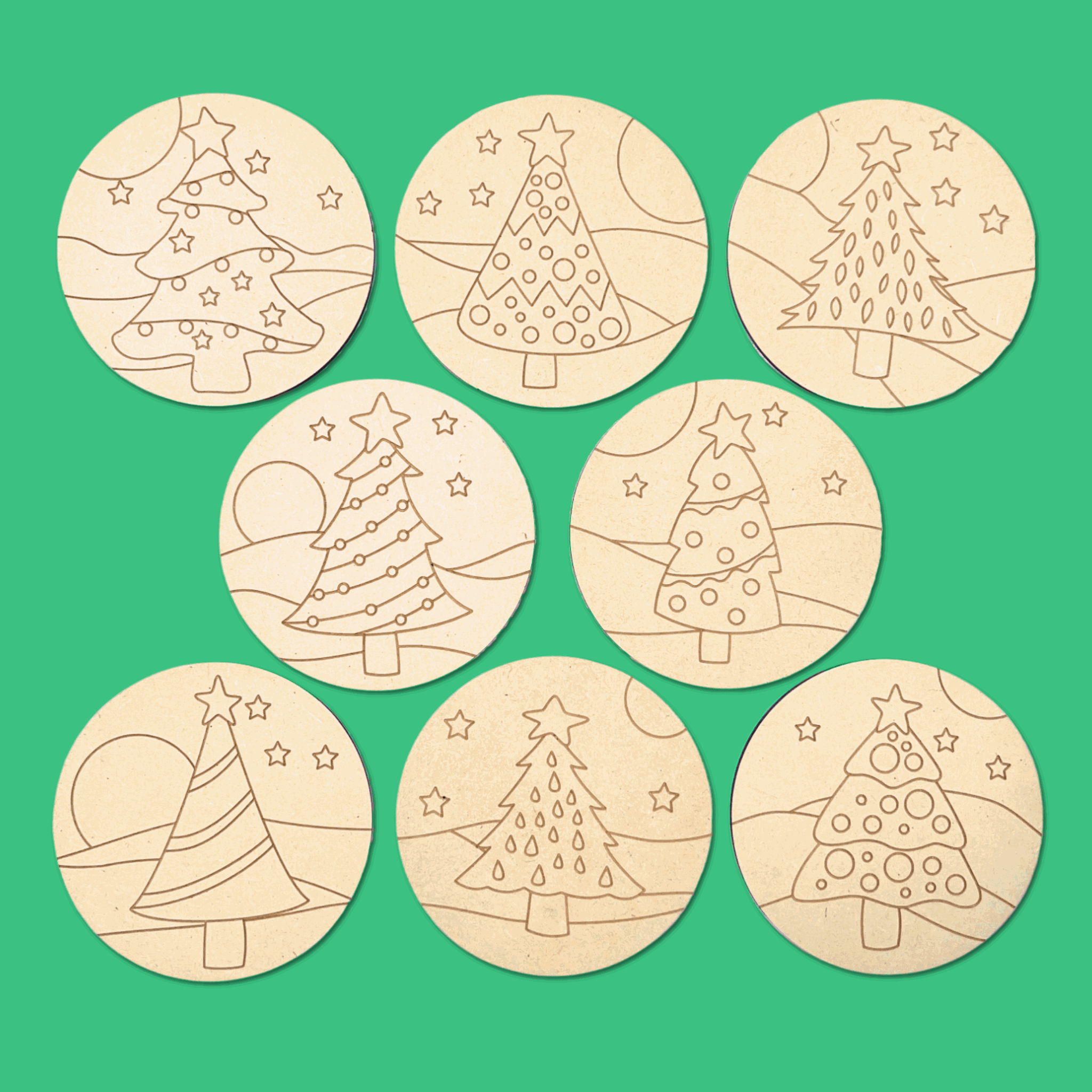 Christmas tree coasters to colour your own, scattered on green, a family Christmas craft for the table